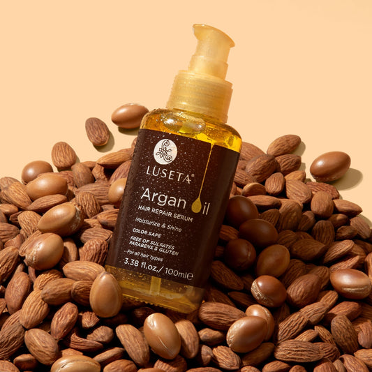 Luseta Beauty Argan Oil Hair Serum — 3.38 fl oz / 100 ml amber pump bottle standing on argan nuts, front label