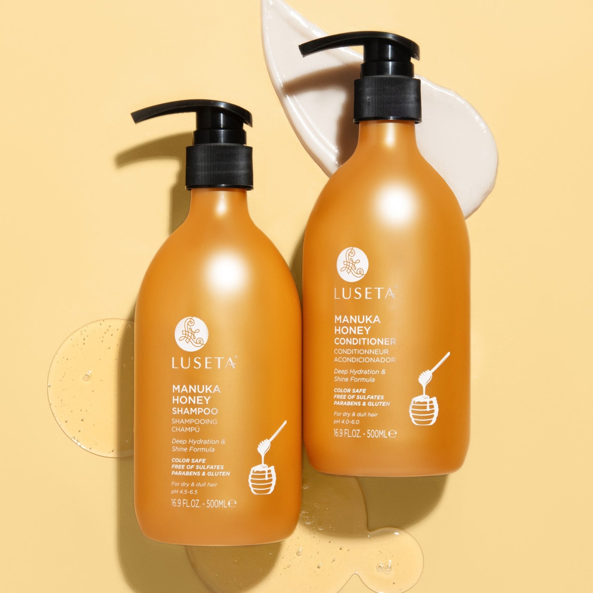 Luseta Beauty Manuka Honey Shampoo & Conditioner Duo - both 16.9 fl oz / 500 ml bottles side by side on amber background