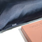 Plug By Must52 Satin Pillowcase — Midnight Blue satin pillowcase on a pillow beside its box, showing the sheen