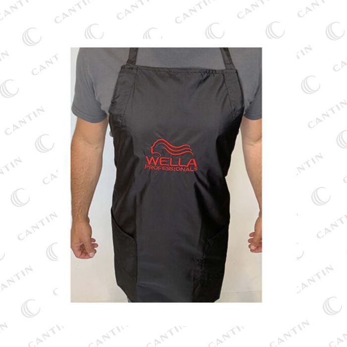 Wella Professionals black salon apron with red Wella Professionals logo, worn