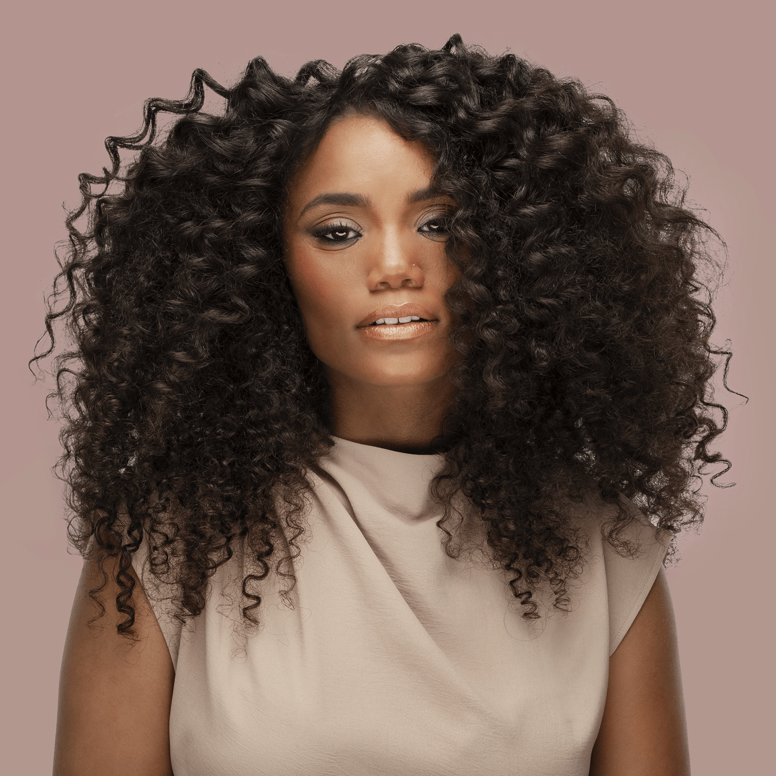 Plug By Must52 Curl Titanium Curling Iron — model with defined spiral curls created with the Curl iron