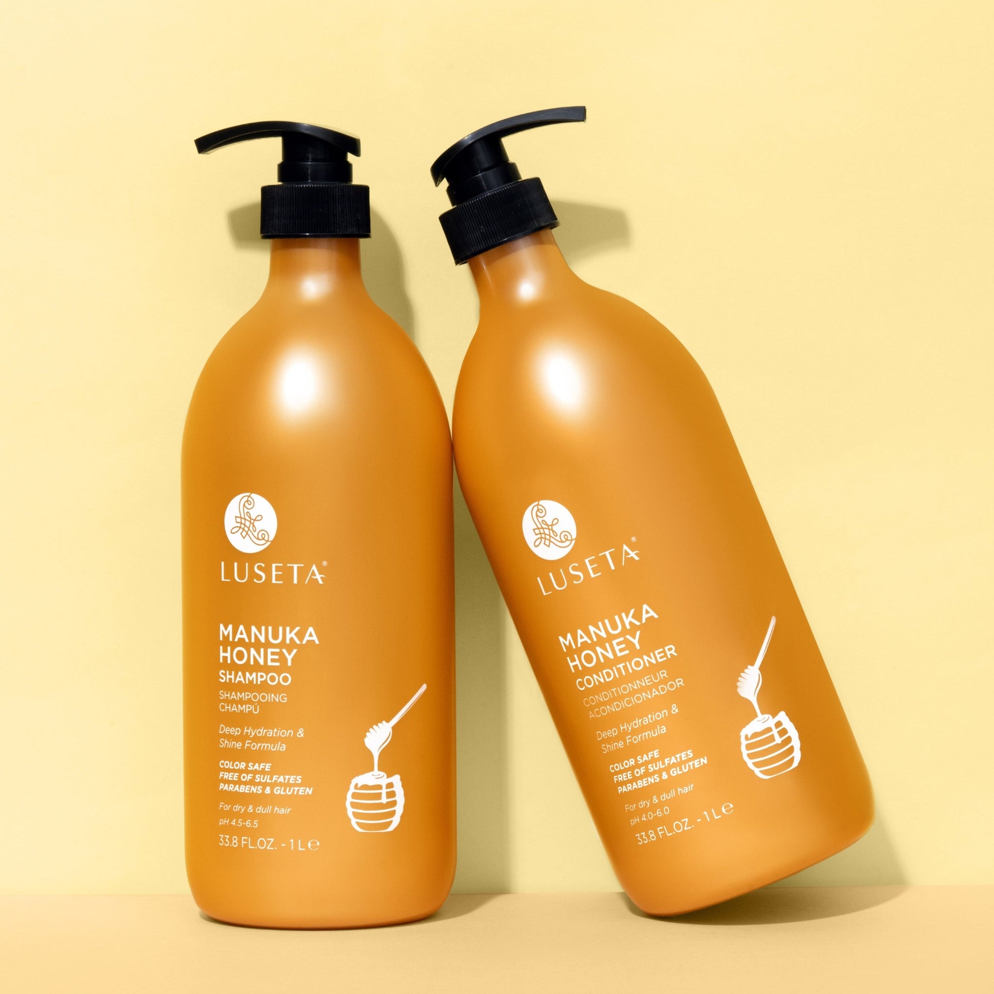 Luseta Beauty Manuka Honey Shampoo & Conditioner Duo - matching 33.8 fl oz / 1 L shampoo and conditioner pair on amber background