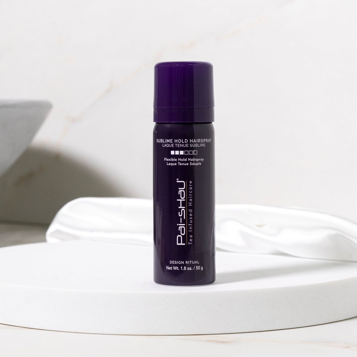 Pai-Shau - Sublime Hold Hairspray — Sublime Hold Hairspray 280 g can on a white pedestal