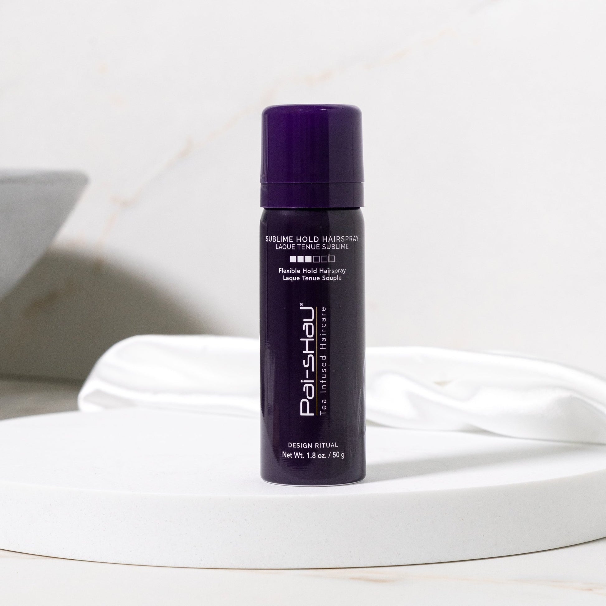 Pai-Shau - Sublime Hold Hairspray — Sublime Hold Hairspray 280 g can on a white pedestal