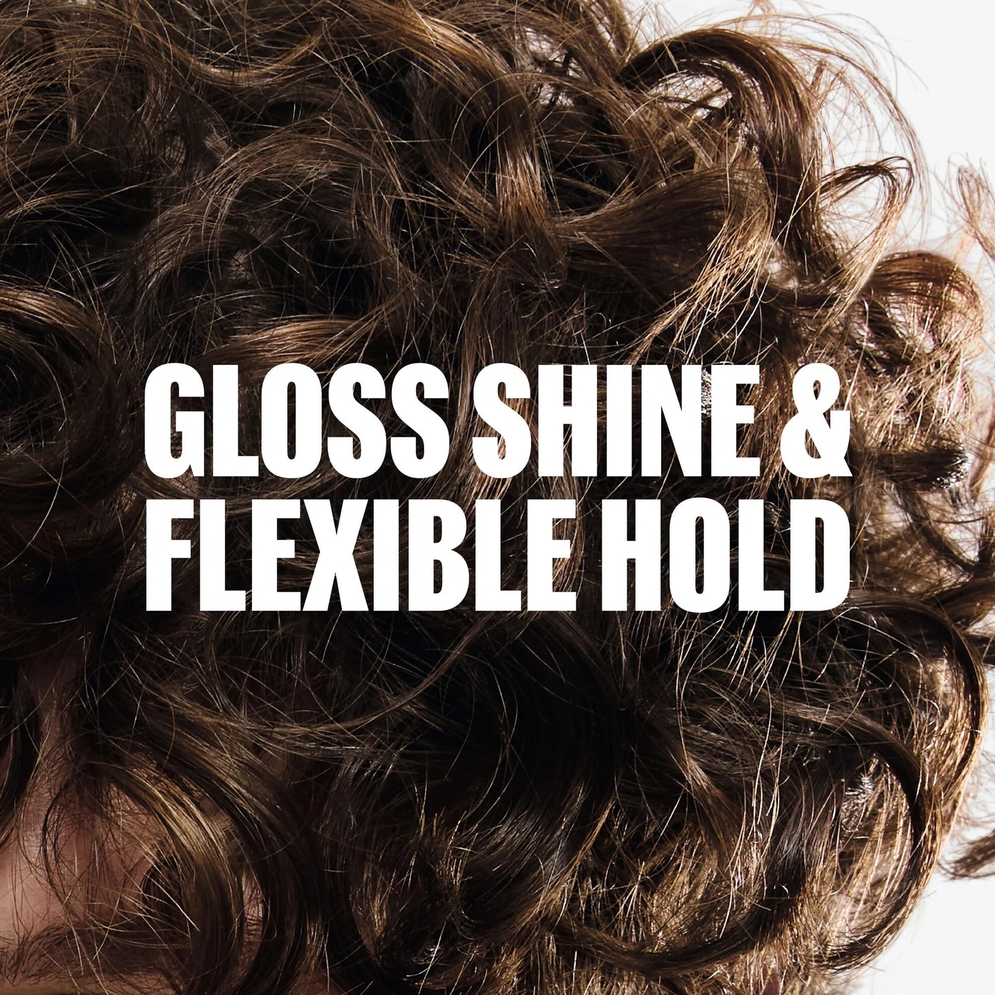 Wella Professionals Eimi — Close-up of curly, textured brown hair with the text "UNLEASH BOLD, DEFINED TEXTURE" overlaid in white.