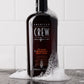 American Crew 24-Hour Deodorant Body Wash bottle in a shower setting