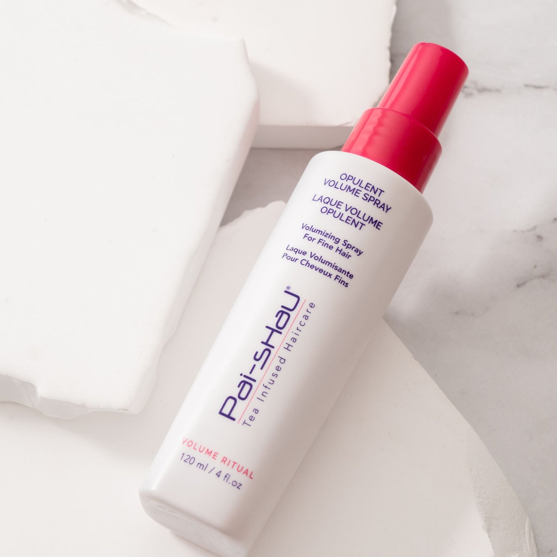 Pai-Shau - Opulent Volume Spray — new-livery white 120 ml spray bottle lying on marble