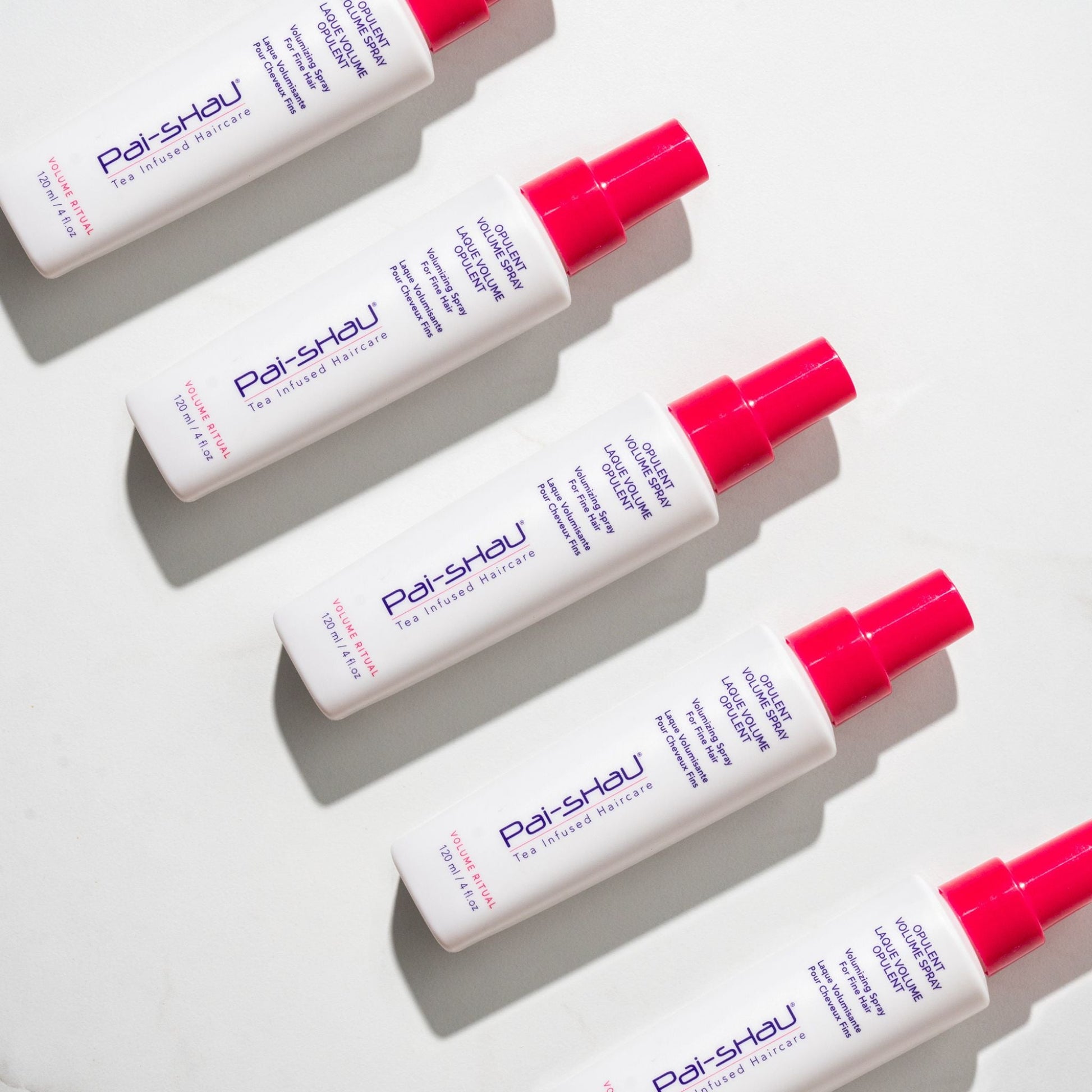 Pai-Shau - Opulent Volume Spray — new-livery white 120 ml spray bottles arranged in a row