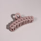 Plug By Must52 Braided Claw Clip — Dusty Pink braided claw clip photographed on a soft lilac surface