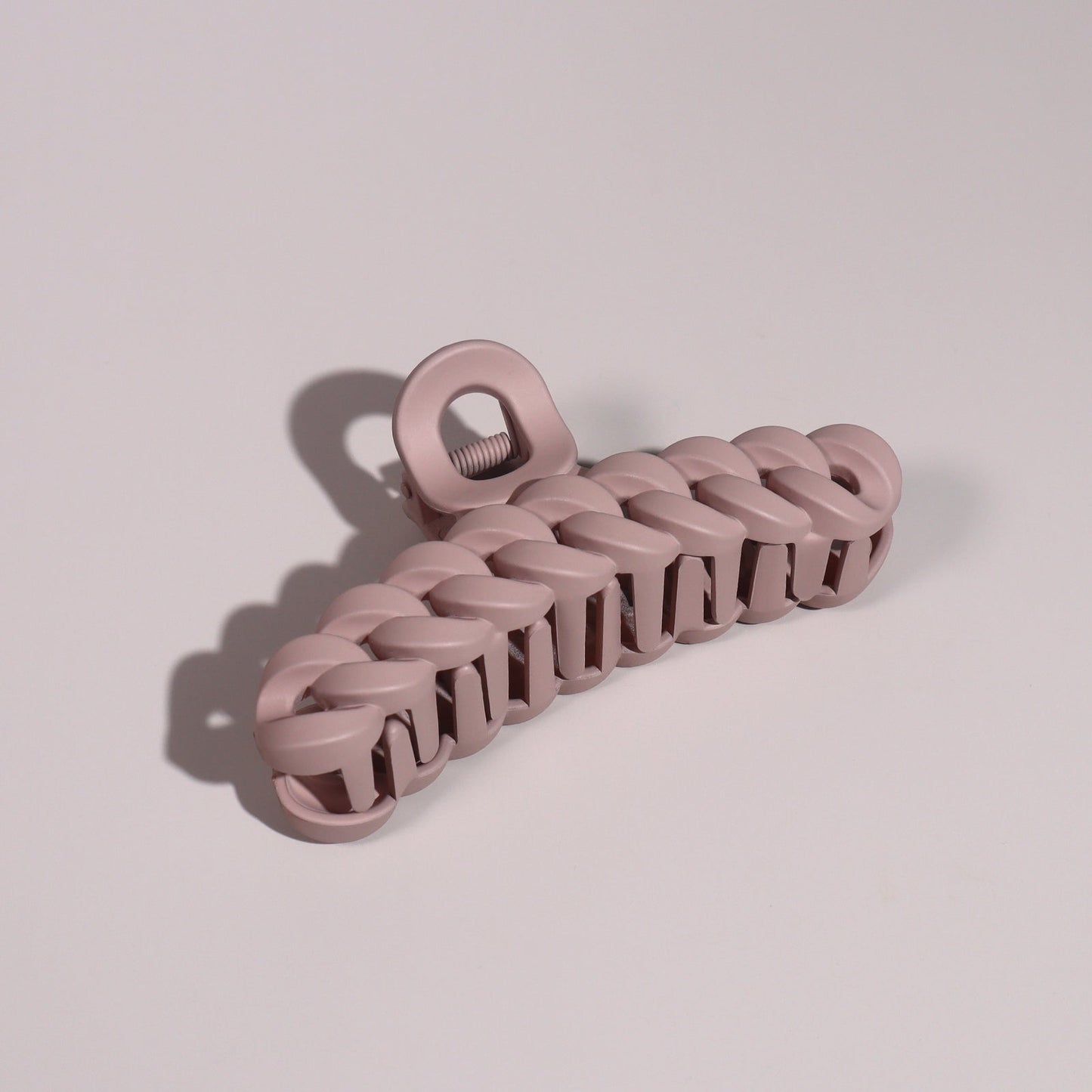 Plug By Must52 Braided Claw Clip — Dusty Pink braided claw clip photographed on a soft lilac surface