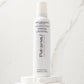 Pai-Shau Volumizing Mousse — current-livery white 227 g mousse can on a stone plinth against marble