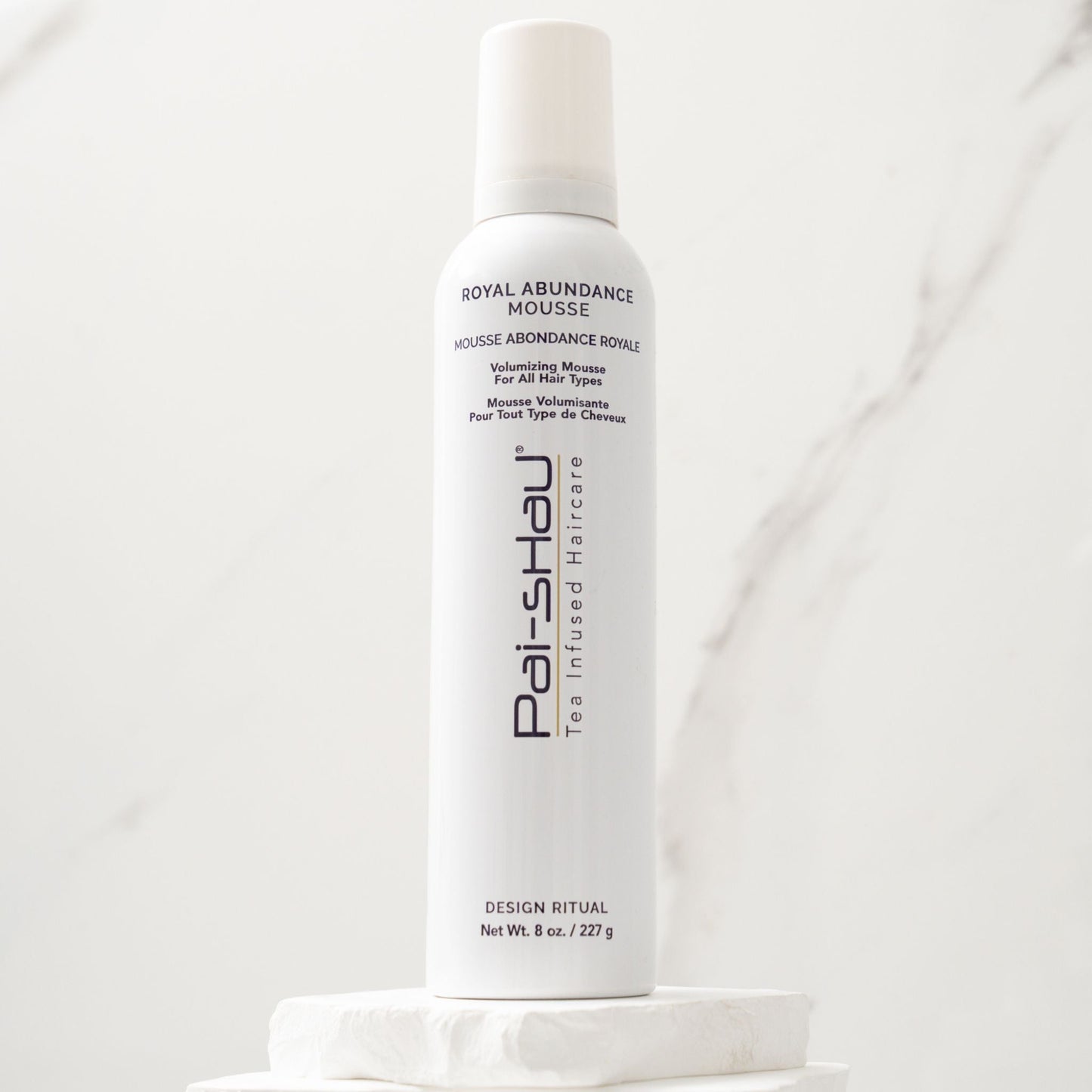 Pai-Shau Volumizing Mousse — current-livery white 227 g mousse can on a stone plinth against marble