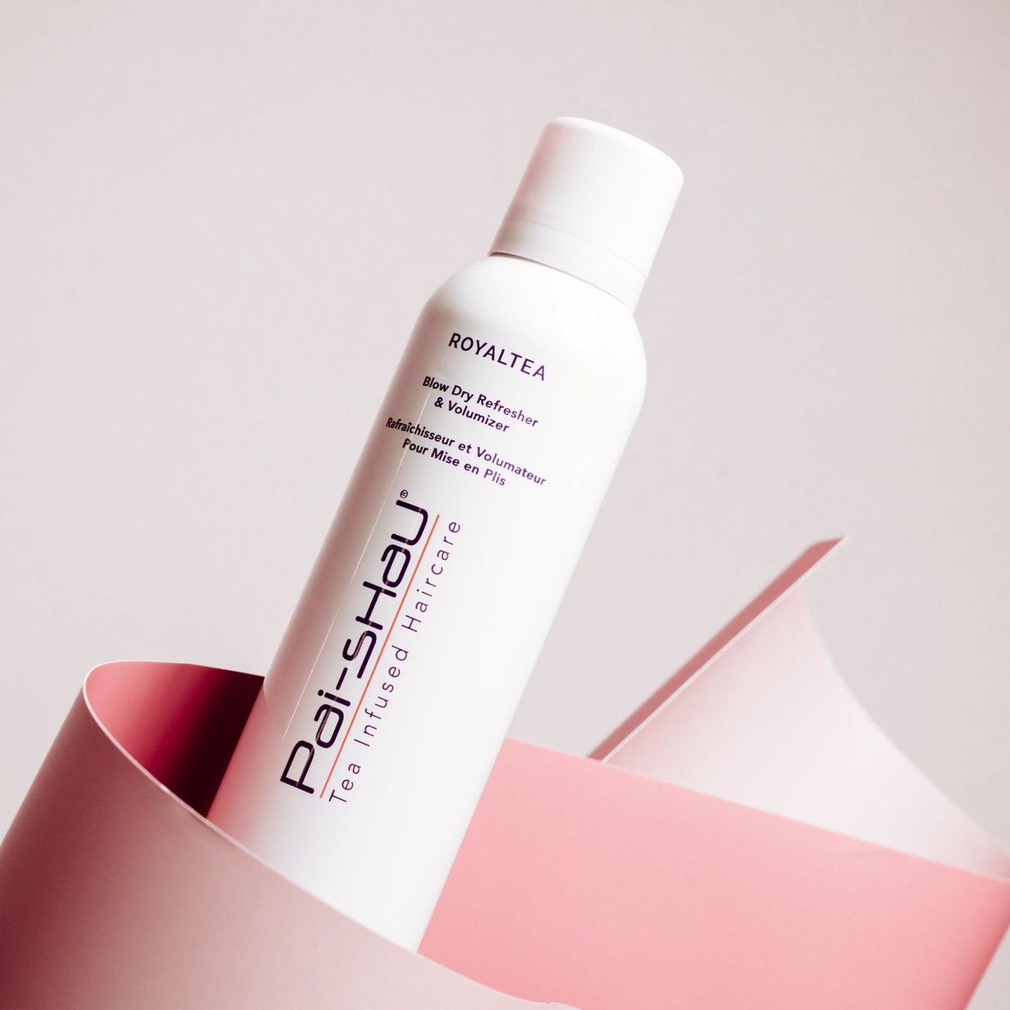 Pai-Shau Dry Shampoo — RoyalTEA 156 g can, angled against pink backdrop