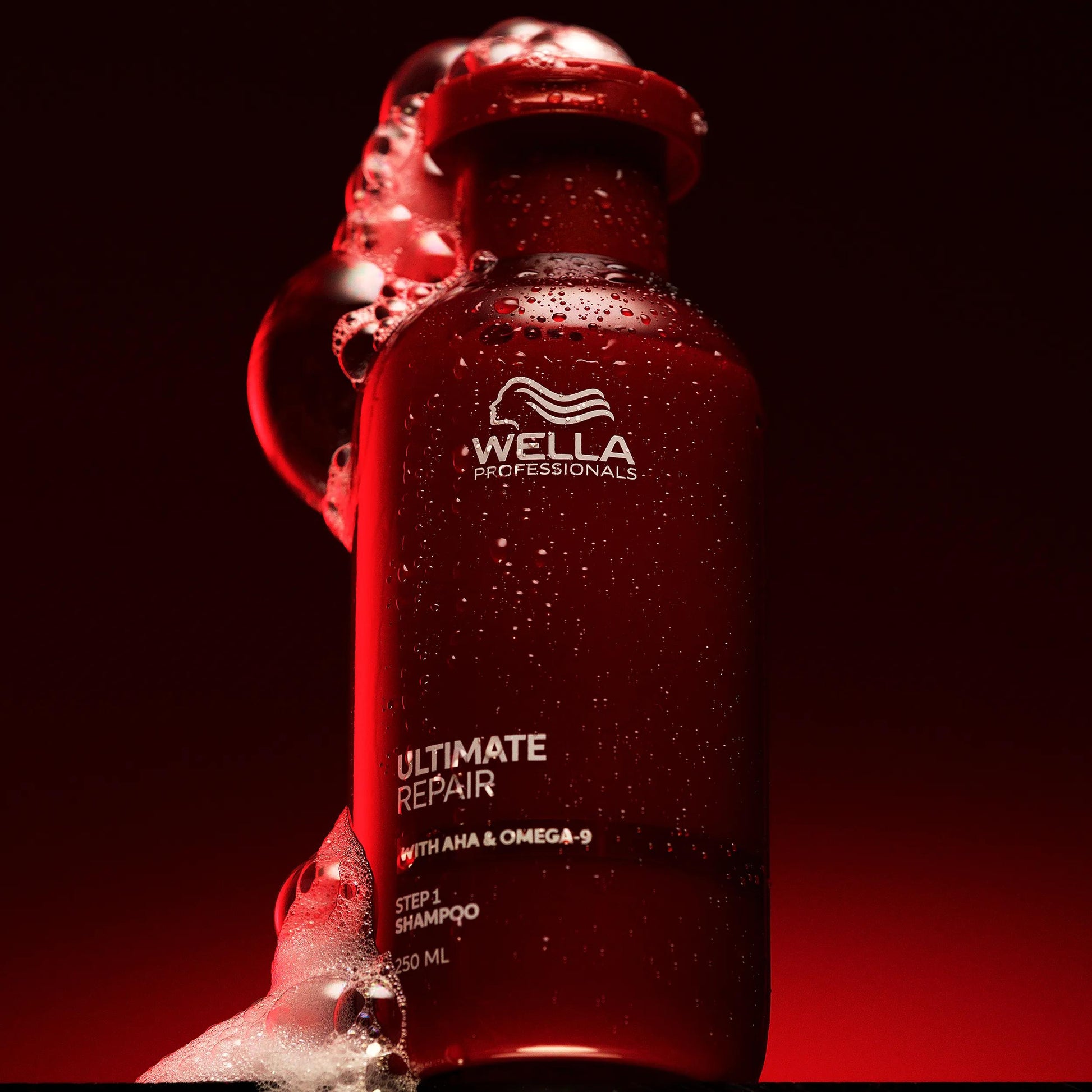 Wella Professionals Ultimate Repair — Packshot of Ultimate Repair Shampoo over a red background