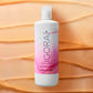 Schwarzkopf IGORA Vibrance Activator Gel — activator gel bottle laid on a swept colour texture