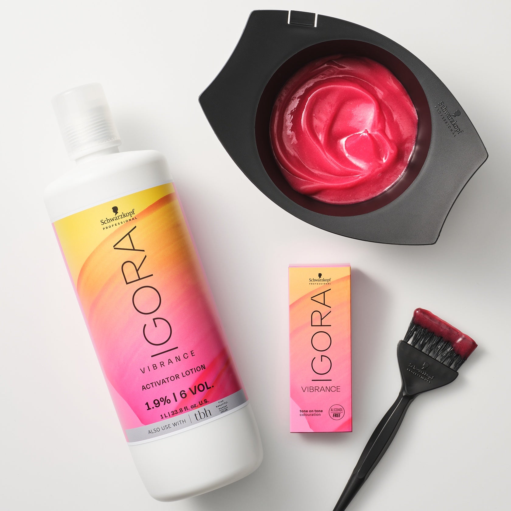 Schwarzkopf IGORA Vibrance Activator Lotion — activator lotion bottle beside a mixing bowl, tint brush and Vibrance carton