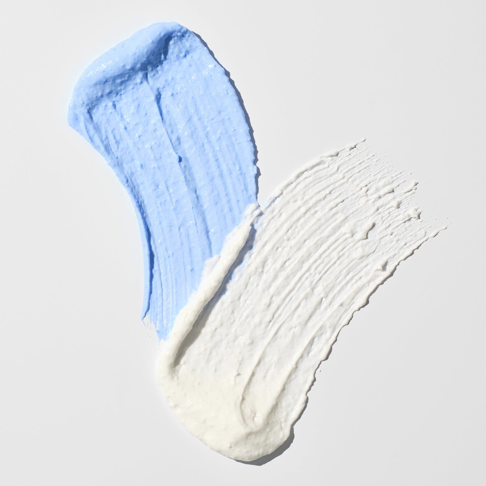 Schwarzkopf IGORA Vario Blond Super Plus — white and blue lightening powder swatches side by side