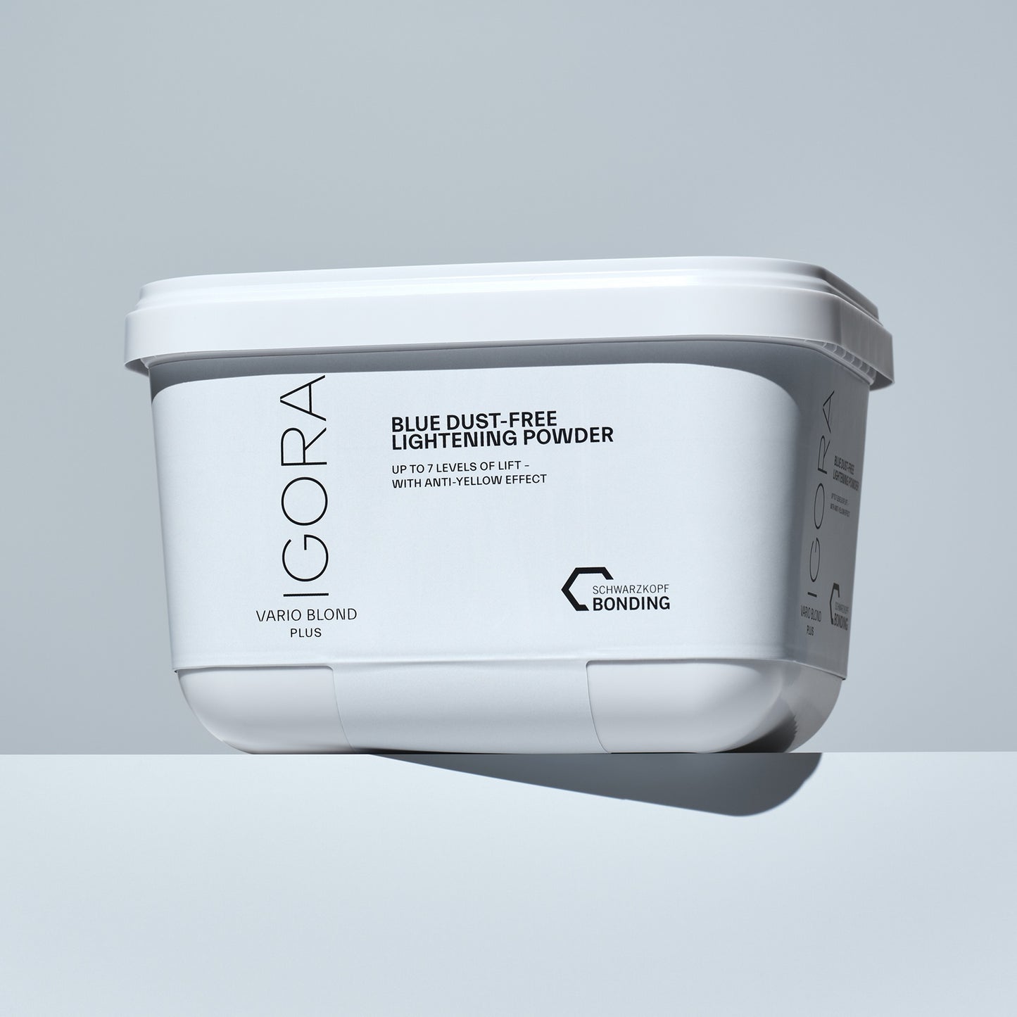 Schwarzkopf IGORA Vario Blond Plus Blue Bleach Dust Free Lightening Powder — current-livery tub, three-quarter view showing the BLUE DUST-FREE LIGHTENING POWDER panel