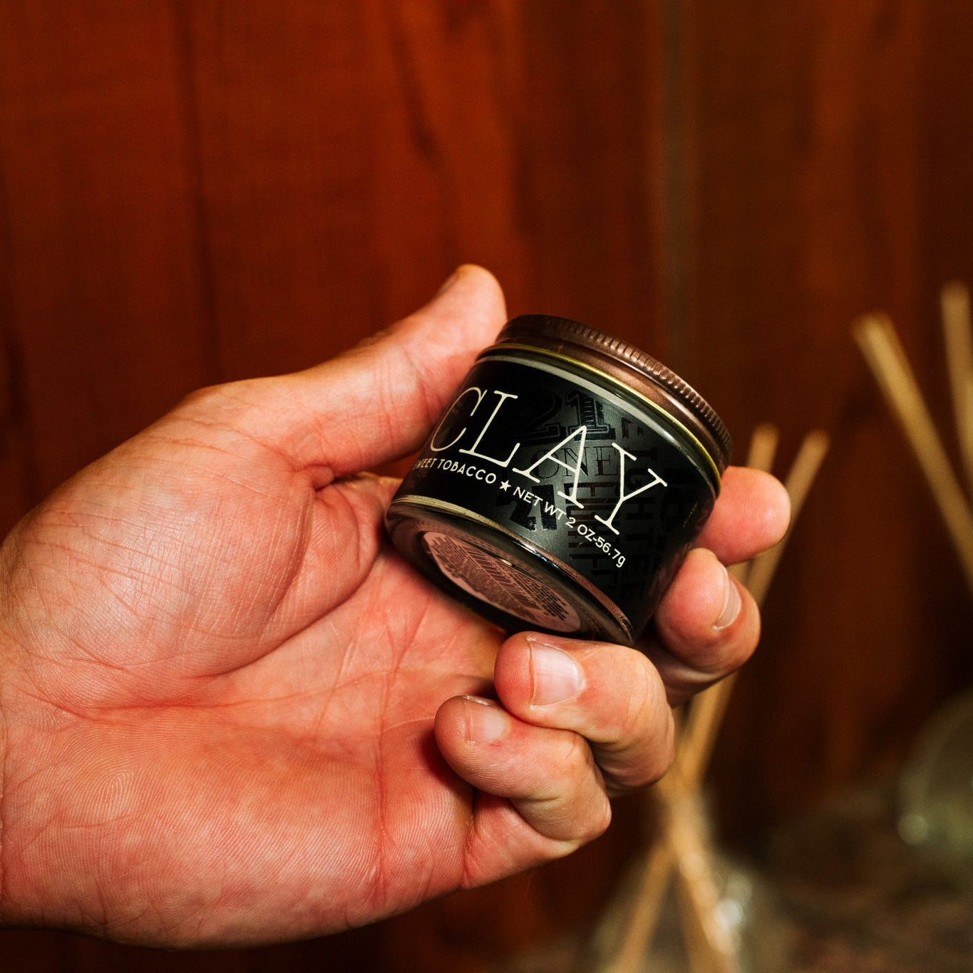 18.21 Man Made Clay — clay jar held in hand