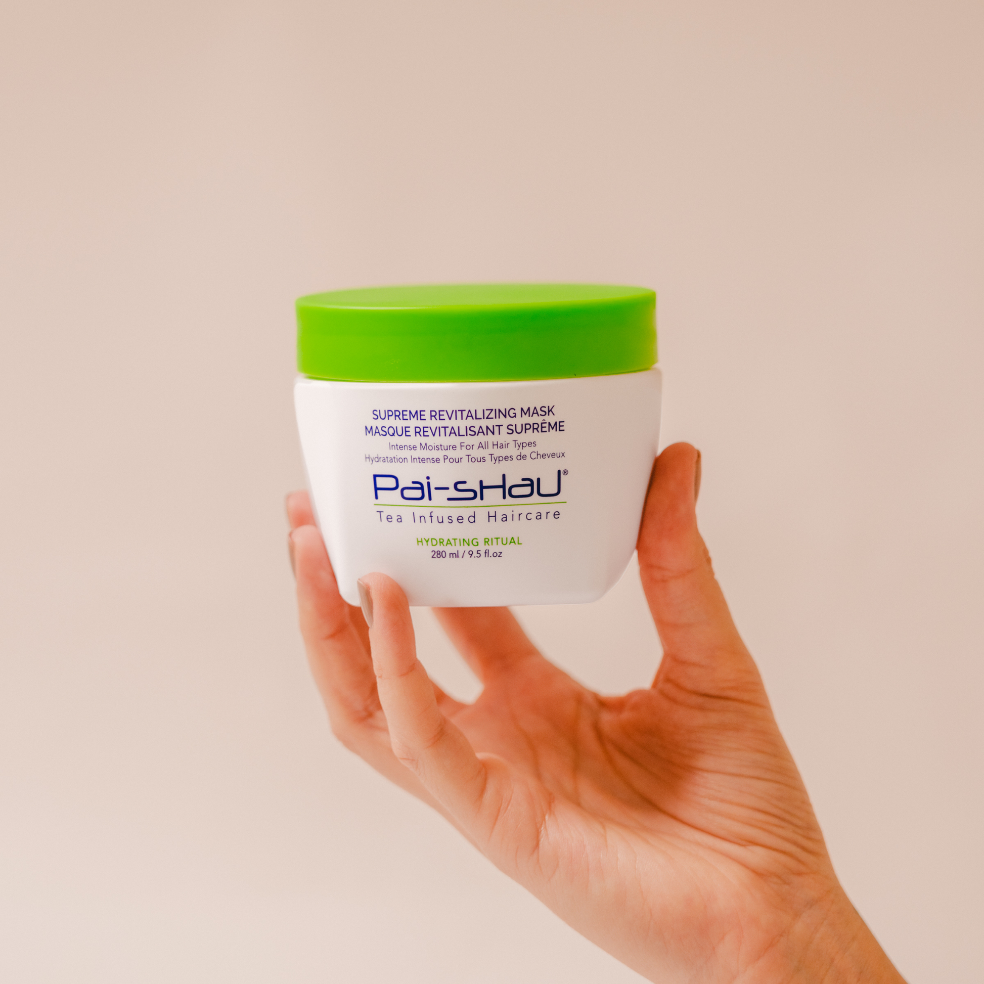 Pai-Shau - Supreme Revitalizing Mask — new-livery white 280 ml jar held in a hand