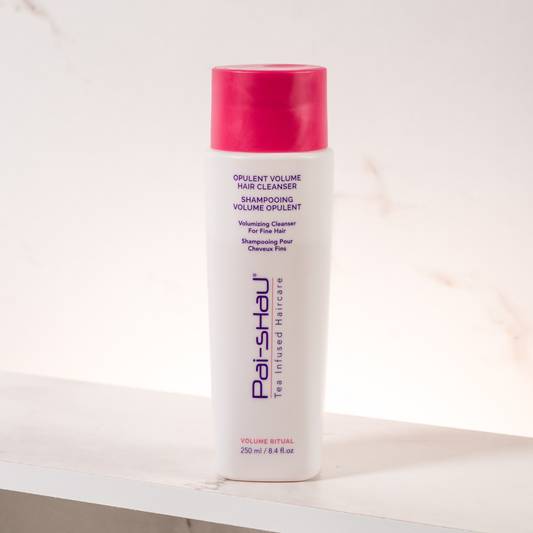 Pai-Shau Volumizing Shampoo — new-livery white 250 ml bottle on a white ledge