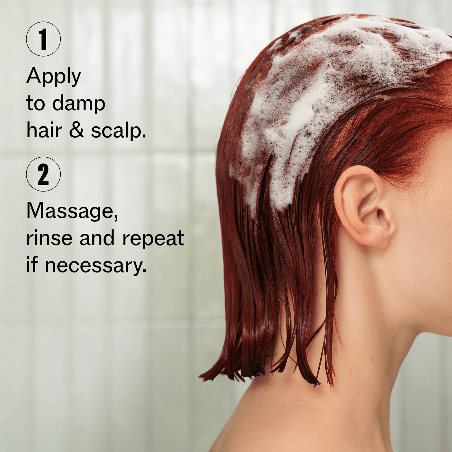 Wella Professionals Ultimate Color — Image of a model's profile, cropped to not show their face. Model's hair is red, short and wet with shampoo foam in it. Text overlay reads "1. Apply to damp hair &amp; scalp. 2. Massage, rinse and repeat if necessary".