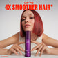 Wella Professionals Ultimate Color — Model with short, red hair leaning their chin against a bottle of Ultimate Color shine spray. Text overlay reads "Up to 4x smoother hair* *vs.untreated".