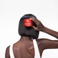 Wella Professionals Ultimate Repair — model applying the mask to a glossy bob