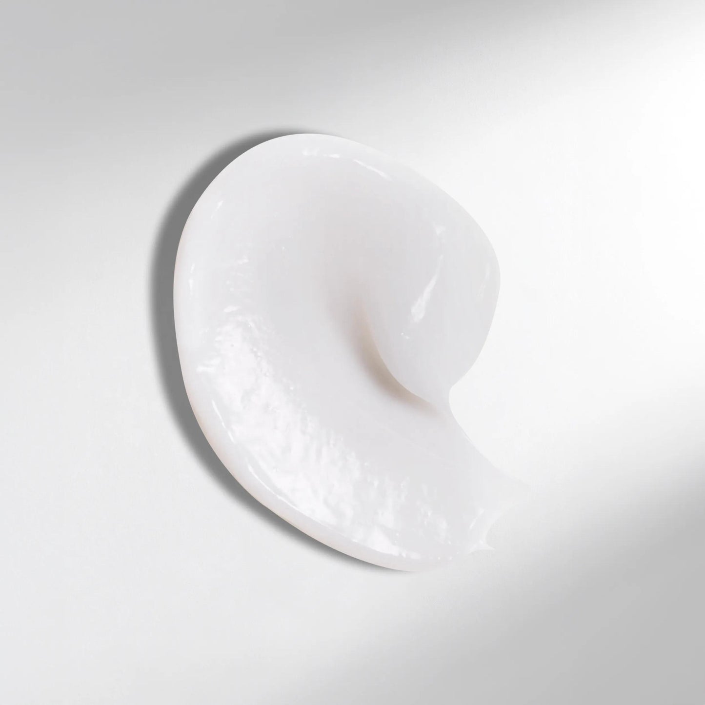 Wella Professionals Ultimate Smooth — Drop of Wella Professionals Ultimate Smooth Conditioner. Text reads rich, nourishing texture.