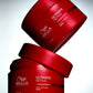 Wella Professionals Ultimate Repair — stacked mask jars on a lit background