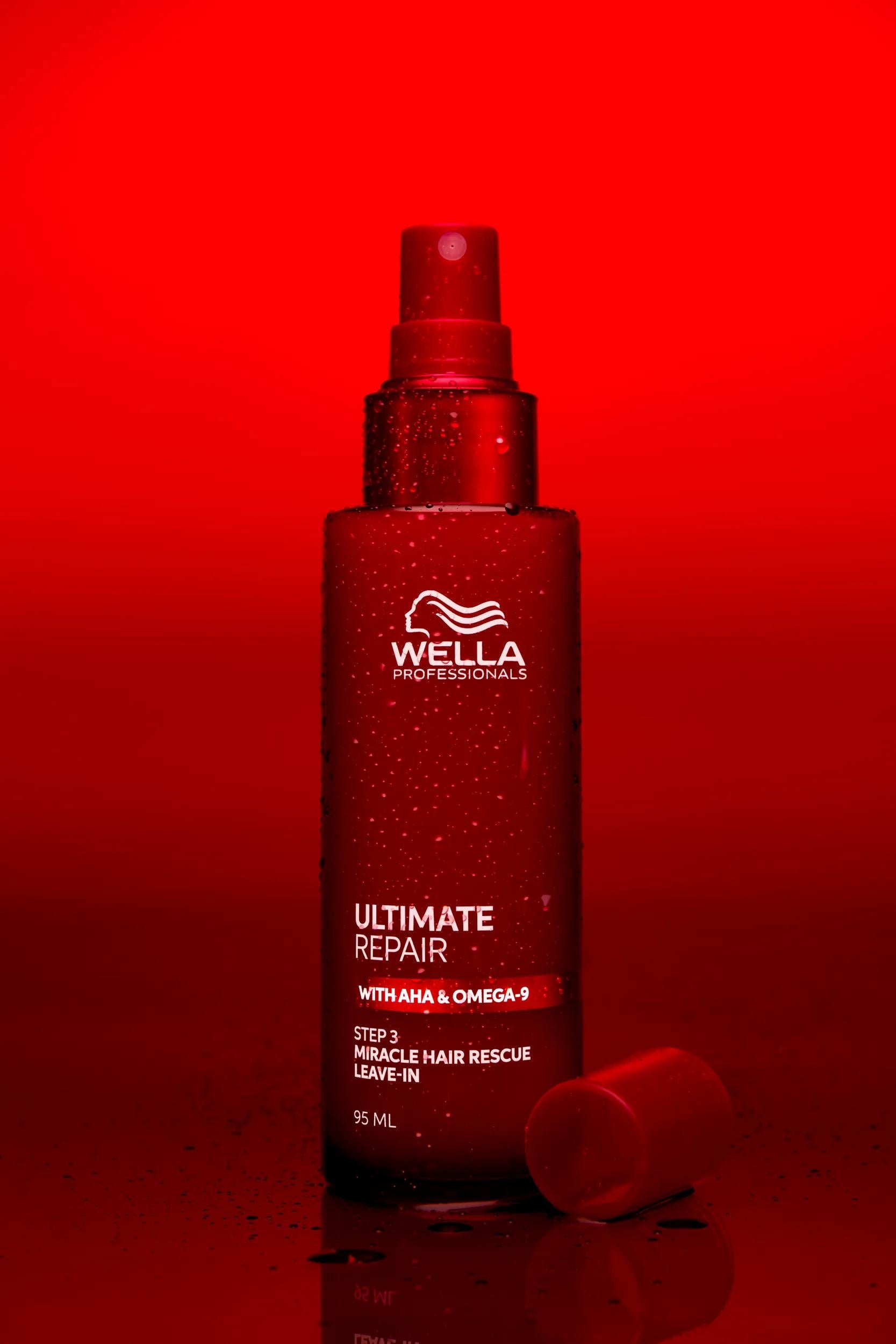Wella Professionals Ultimate Repair — Packshot of Wella Ultimate Repair Miracle Hair Rescue Leave-in over a red background.