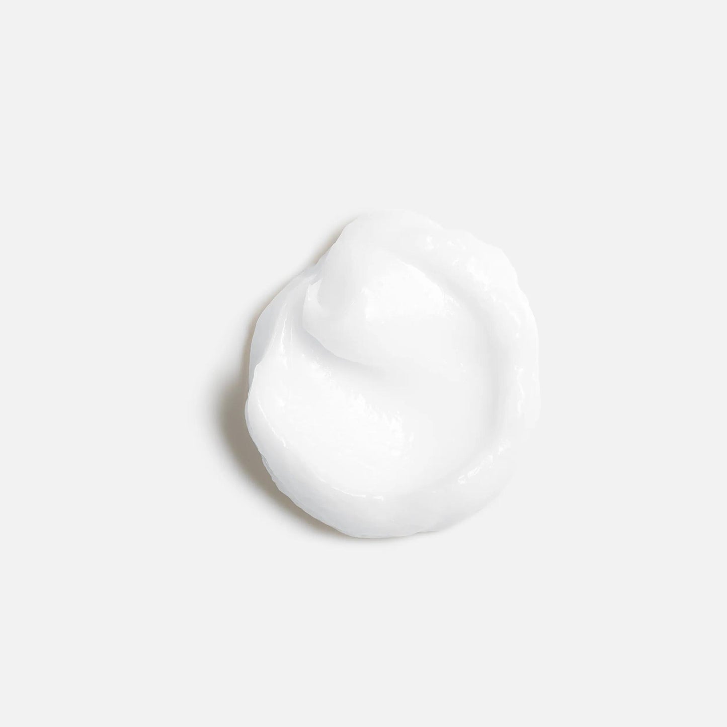 Wella Professionals NutriCurls — A small dollop of white cream against a plain white background.