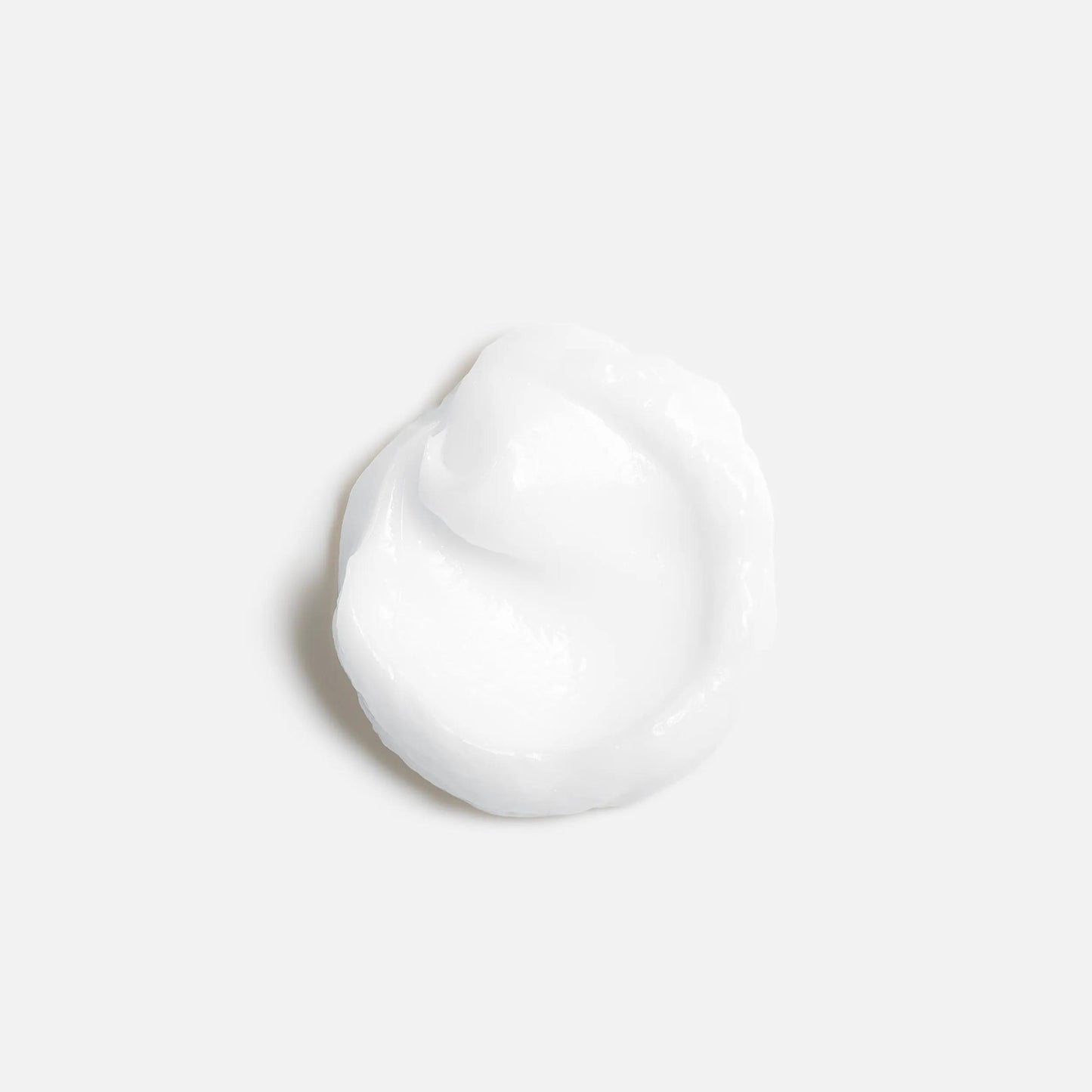 Wella Professionals NutriCurls — A small dollop of white cream against a plain white background.