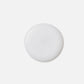 Wella Professionals NutriCurls — A smooth, round drop of white liquid.