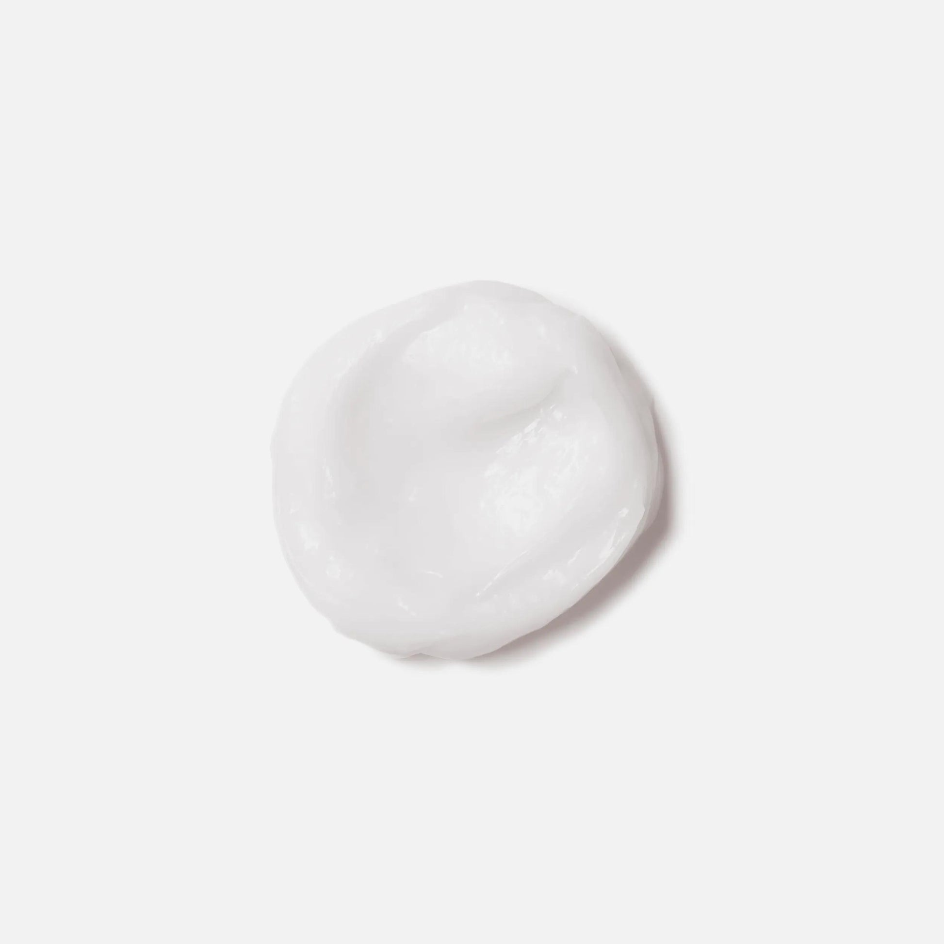 Wella Professionals NutriCurls — A small dollop of white cream against a plain white background.