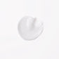Wella Professionals Invigo Brilliance — Close-up photograph of a circular blob of Invigo Brilliance product on a white background, with text saying 'antioxidant shield, helps control the oxidation process after coloring' and 'metal purifier, protects from harmful metals in water'.