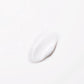Wella Professionals Invigo Brilliance — Close-up photograph of a circular blob of Invigo Brilliance product on a white background, with text saying 'antioxidant shield, helps control the oxidation process after coloring' and 'metal purifier, protects from harmful metals in water'.
