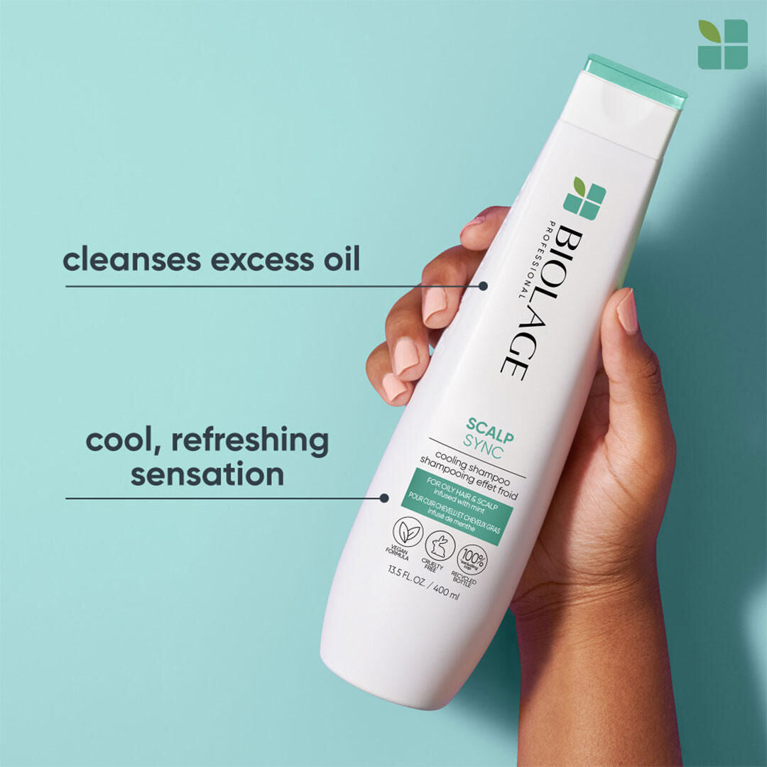 Biolage ScalpSync Cool Mint Shampoo 400 ml — new-livery white bottle with teal cap, held in hand