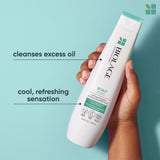 Biolage ScalpSync Cool Mint Shampoo 400 ml — new-livery white bottle with teal cap, held in hand