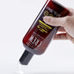 American Crew 3-in-1 Ginger + Tea poured into a hand