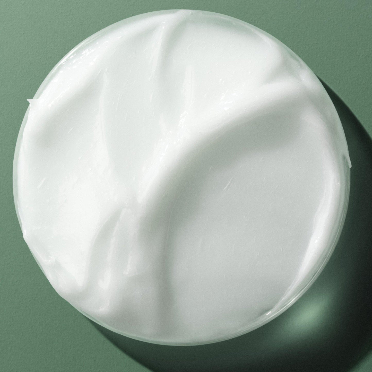 Macro texture shot of Biolage Smoothing Shine Milk formula