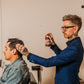 18.21 Man Made Premium Hair Spray — stylist finishing with hair spray, lifestyle shot