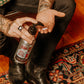 18.21 Man Made Octane 500 Hand & Body Lotion — lotion pumped into hand, lifestyle shot