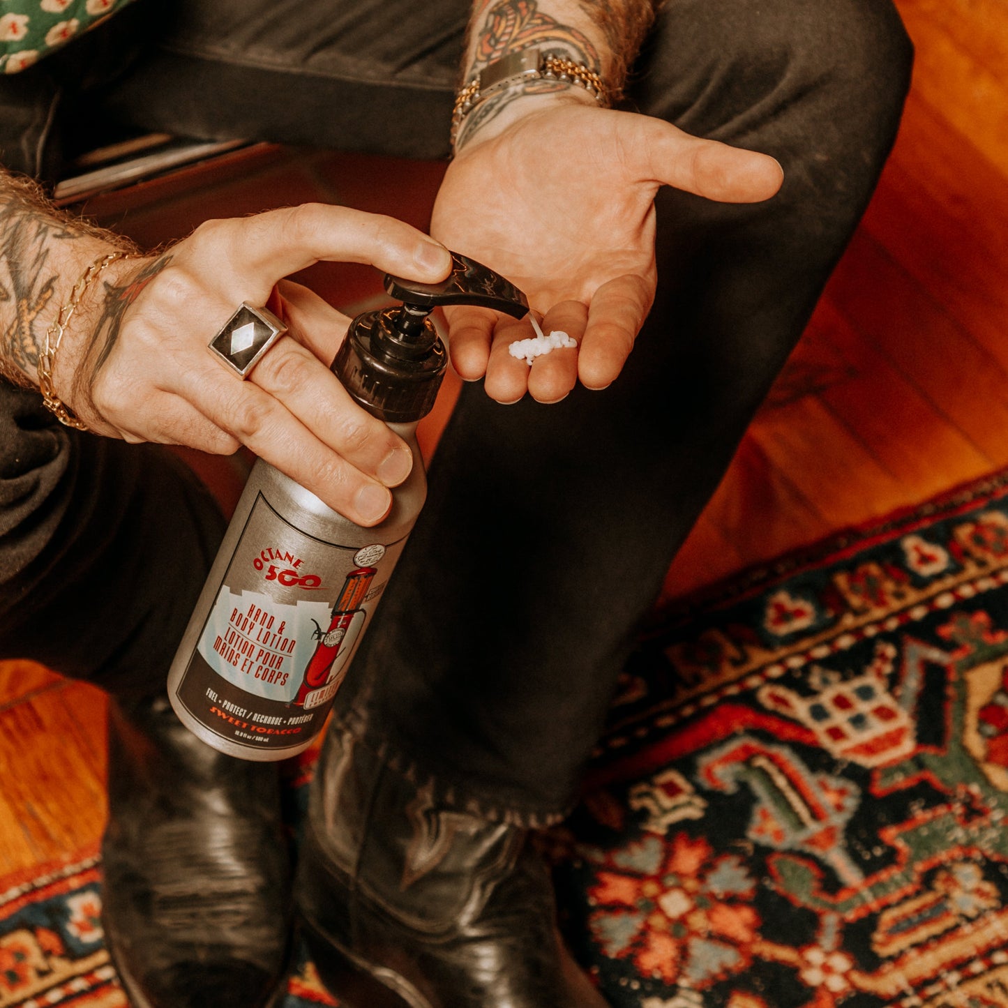 18.21 Man Made Octane 500 Hand & Body Lotion — lotion pumped into hand, lifestyle shot